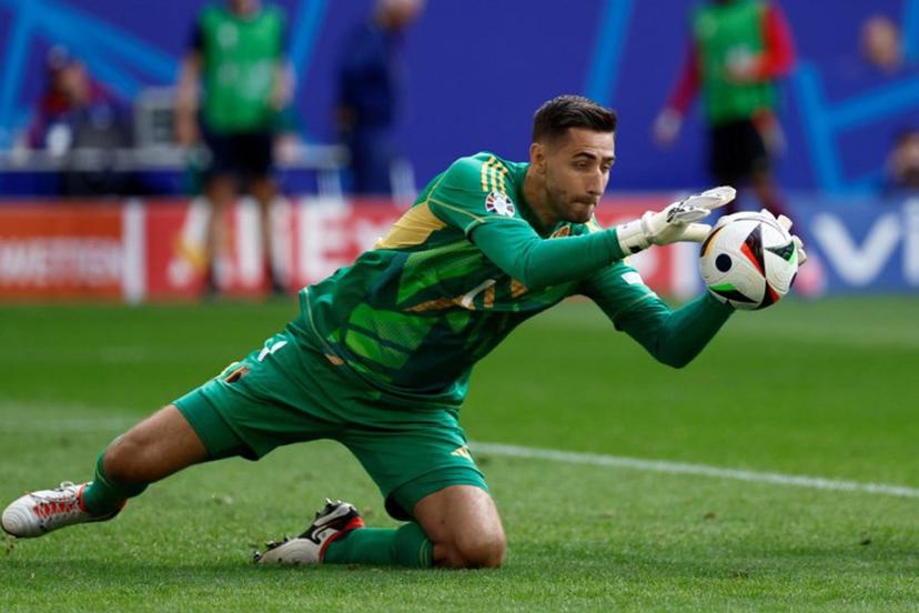 Belgium's goalkeeper #01 Koen Casteels catches the ball during the UEFA Euro 2024 round of 16 football match between France and Belgium at the Duesseldorf Arena in Duesseldorf on July 1, 2024.  KENZO TRIBOUILLARD / AFP