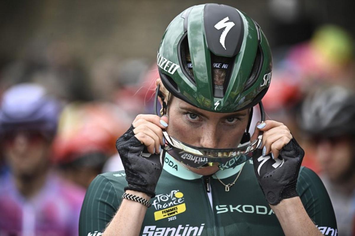 FDJ-SUEZ team's Dutch rider Demi Vollering adjusts her cycling glasses during the 2nd stage (out of 9) of the fourth edition of the Women's Tour de France cycling race, 110,4 km from Brest to Quimper, in France, on July 27, 2025.  JULIEN DE ROSA / AFP