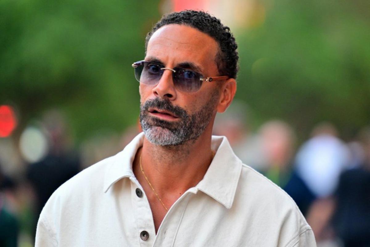 Former English footballer Rio Ferdinand walks in the paddock ahead of the Formula One Qatar Grand Prix at the Lusail International Circuit in Lusail on November 30, 2025.  Andrej ISAKOVIC / AFP