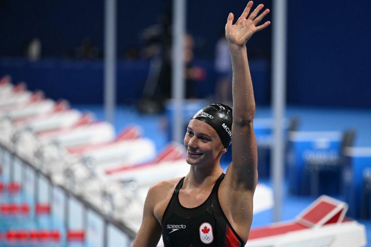 Canada's Summer Mcintosh celebrates after winning the final of the women's 200m individual medley swimming event during the Paris 2024 Olympic Games at the Paris La Defense Arena in Nanterre, west of Paris, on August 3, 2024.  Jonathan NACKSTRAND / AFP
