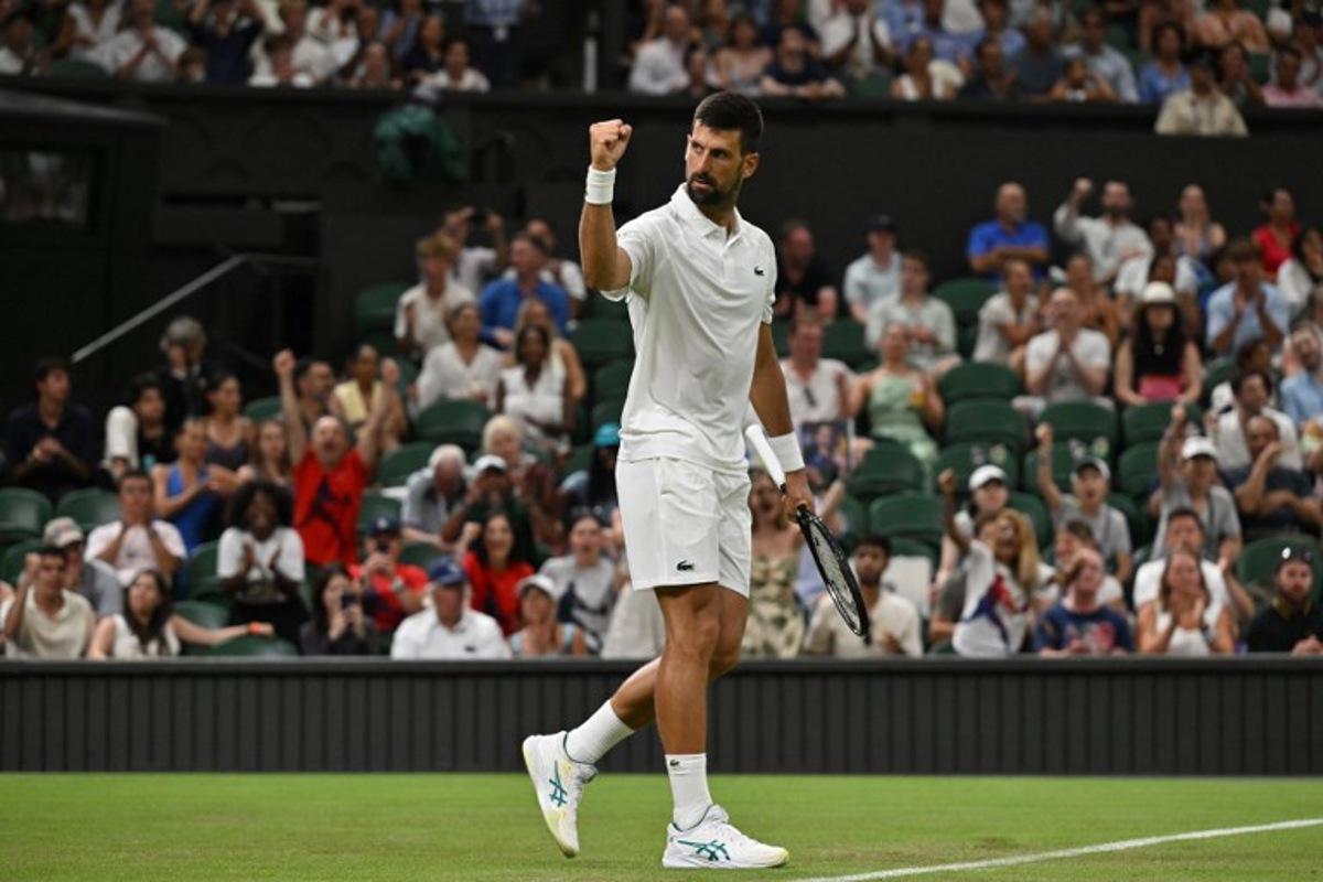 Serbia's Novak Djokovic reacts after a point as he plays against France's Alexandre Muller during their men's singles first round tennis match on the second day of the 2025 Wimbledon Championships at The All England Lawn Tennis and Croquet Club in Wimbledon, southwest London, on July 1, 2025.  Glyn KIRK / AFP