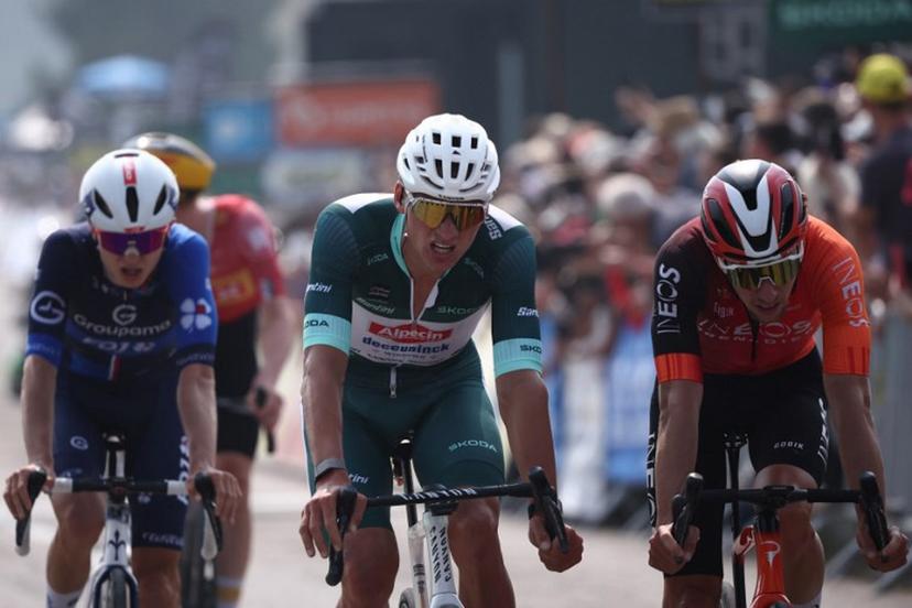 Alpecin-Deceuninck's Dutch rider Mathieu van der Poel (C) wearing the sprinter's green jersey reacts as he crosses the finish line of the 3rd stage of the 77th edition of the Criterium du Dauphine cycling race, 207,2 km between Brioude and Charantonnay, on June 10, 2025.  Anne-Christine POUJOULAT / AFP