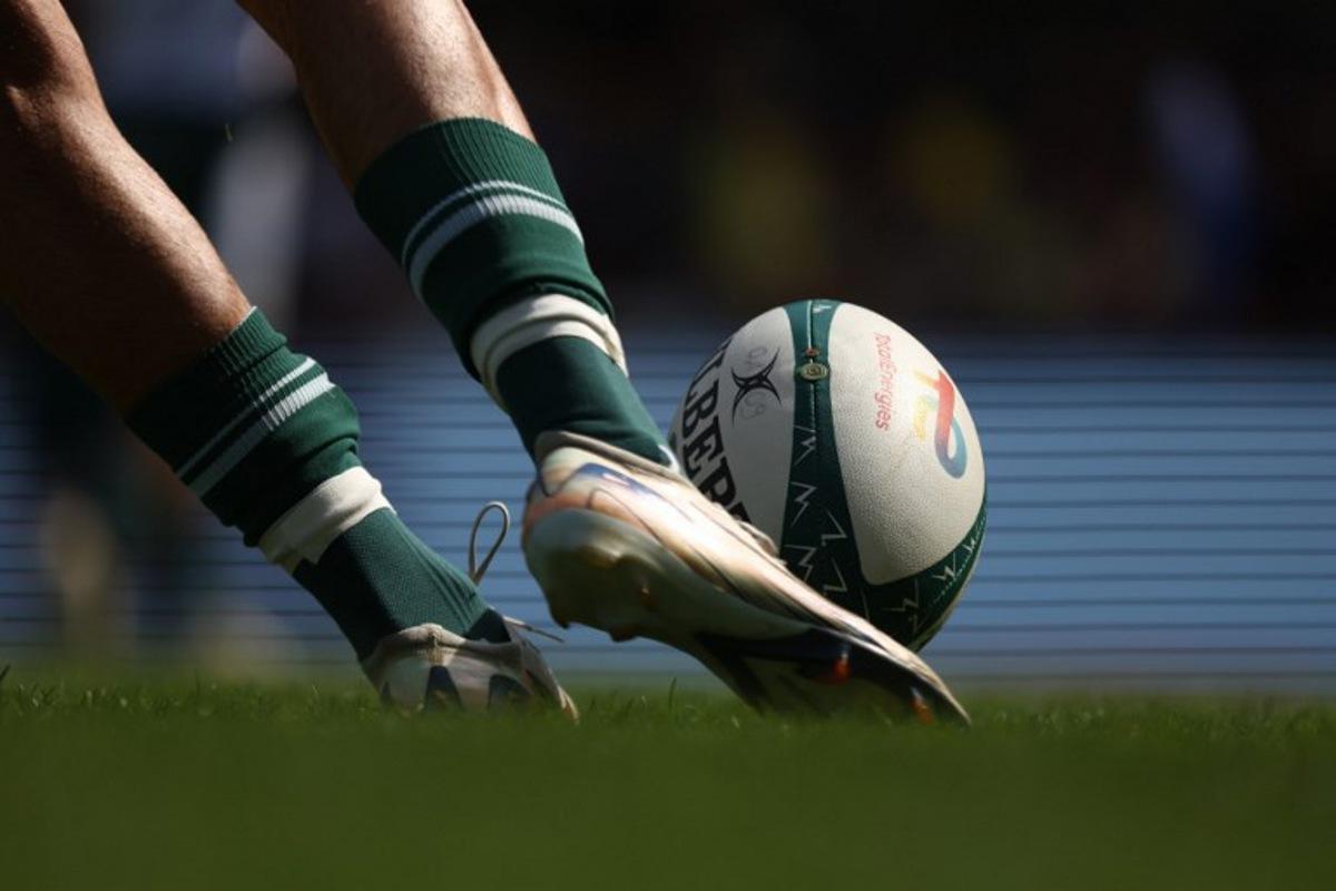 A player kicks the ball during the French Top 14 rugby union match between ASM Clermont Auvergne and Section Paloise Bearn Pyrenees (Pau) at the Marcel Michelin stadium in Clermont-Ferrand, central France on September 20, 2025.  Alex MARTIN / AFP