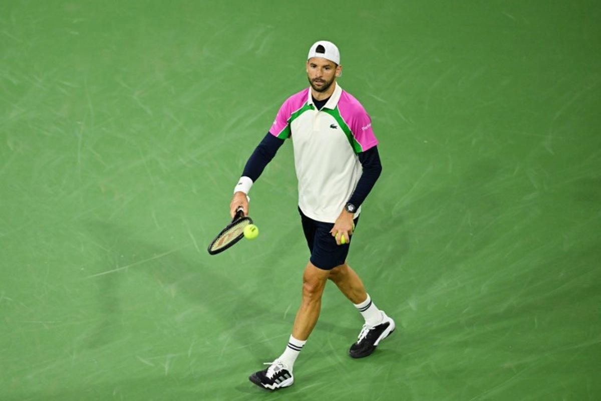 Bulgaria's Grigor Dimitrov reacts during his Round of 16 men's singles tennis match against Spain's Carlos Alcaraz at the BNP Paribas Open at the Indian Wells Tennis Garden in Indian Wells, California, on March 12, 2025.  Patrick T. Fallon / AFP