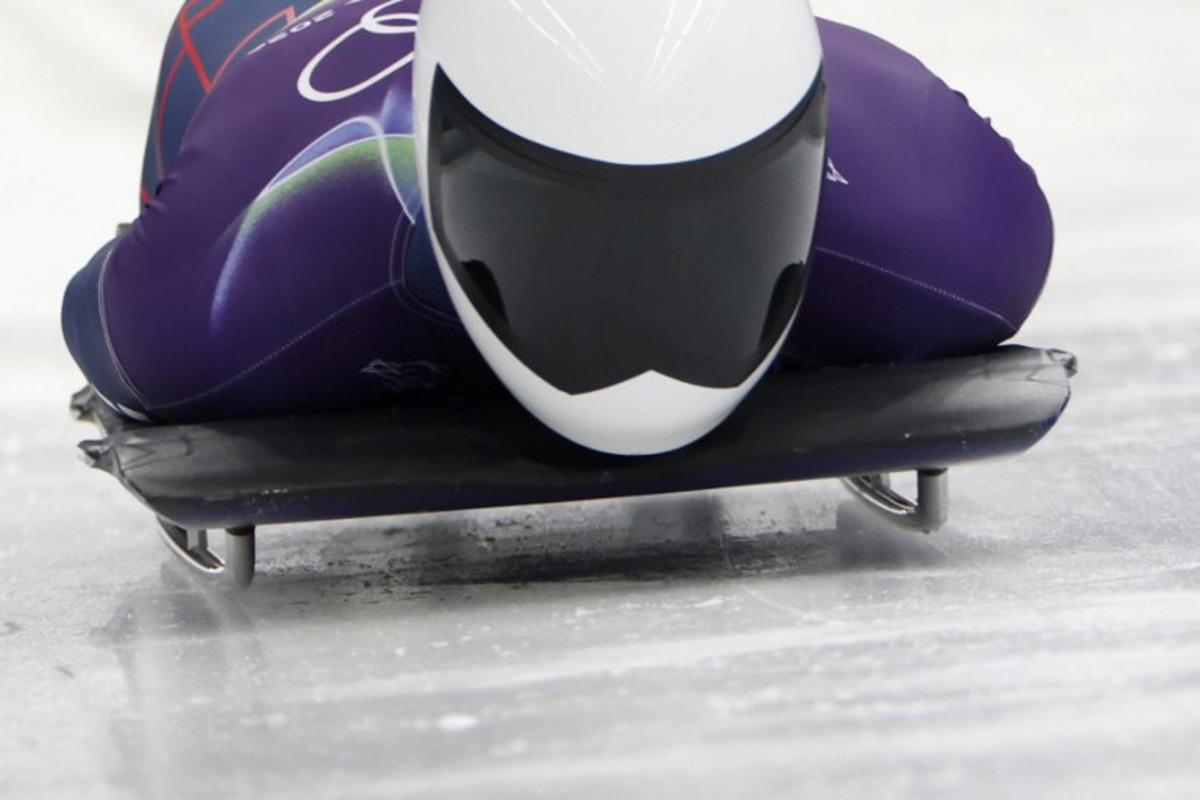 Britain's Matt Weston competes in the skeleton men's heat 1 at Cortina Sliding Centre during the Milano Cortina 2026 Winter Olympic Games in Cortina d'Ampezzo on February 12, 2026.  Odd ANDERSEN / AFP