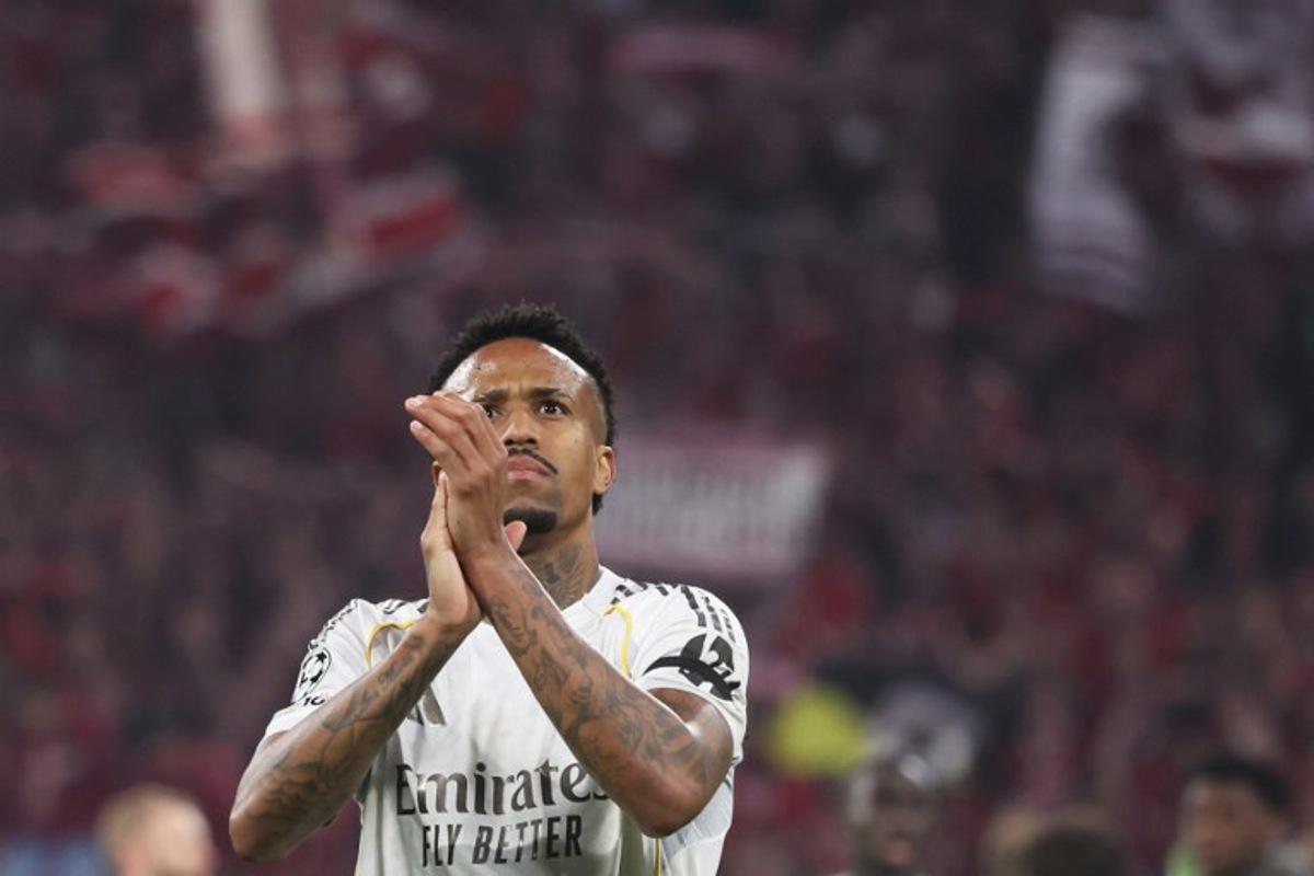 Real Madrid's Brazilian defender #03 Eder Militao greets the fans after the end of the UEFA Champions League quarter-final second leg football match between FC Bayern Munich and Real Madrid in Munich, southern Germany, on April 15, 2026.  Karl-Josef HILDENBRAND / AFP