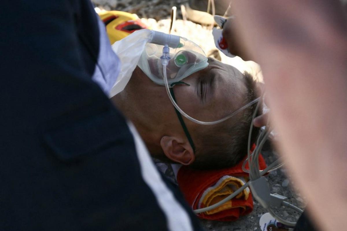 Uno-X Mobility team's Norwegian rider Tobias Johannessen receives medical assistance upon arrival at the summit of Mont Ventoux during the 16th stage of the 112th edition of the Tour de France cycling race, 171.5 km between Montpellier and Mont Ventoux, southern France, on July 22, 2025.  Marco BERTORELLO / AFP