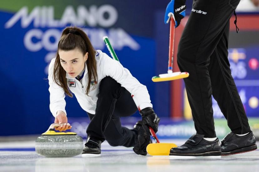 Italy's Stefania Constantini (L) competes in the curling mixed doubles round robin between Sweden and Italy during the Milano Cortina 2026 Winter Olympic Games at the Cortina Curling Olympic Stadium in Cortina d'Ampezzo on February 7, 2026.  Odd ANDERSEN / AFP