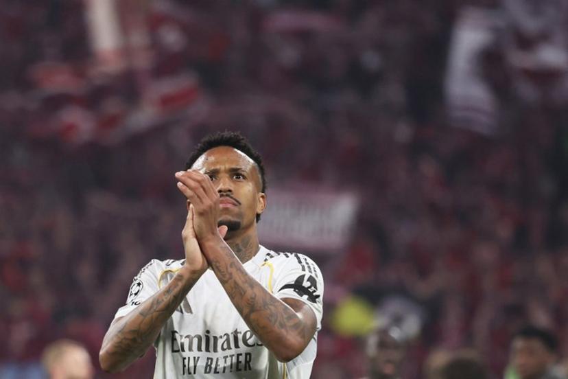 Real Madrid's Brazilian defender #03 Eder Militao greets the fans after the end of the UEFA Champions League quarter-final second leg football match between FC Bayern Munich and Real Madrid in Munich, southern Germany, on April 15, 2026.  Karl-Josef HILDENBRAND / AFP