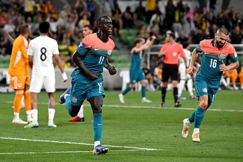 Australia's Awer Mabil (C) celebrates after scoring a goal during the international friendly football match between Australia and Curacao at the Melbourne Rectangular Stadium in Melbourne on March 31, 2026.  WILLIAM WEST / AFP