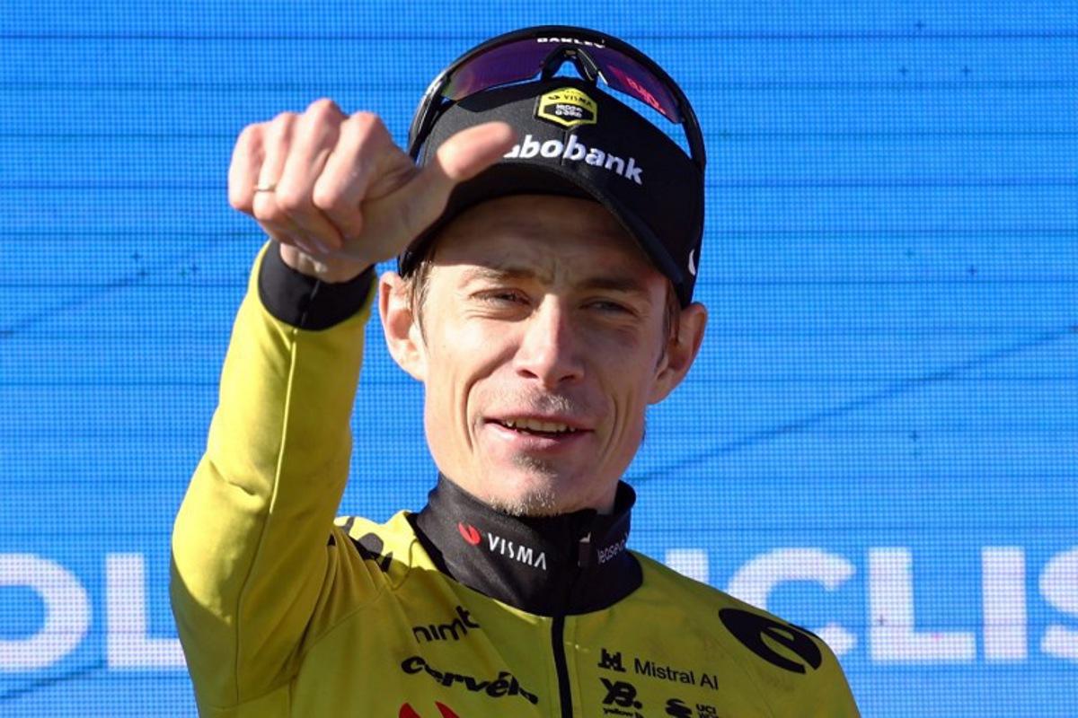 Stage winner Team Visma-Lease a bike's Danish rider Jonas Vingegaard celebrates on the podium after becoming the new overall ranking leader after the fifth stage of the 2026 Volta a Catalunya cycling tour of Catalonia, a 155,5 km race between La Seu d'Urgell and La Molina ski resort in Alp, on March 27, 2026.  Josep LAGO / AFP