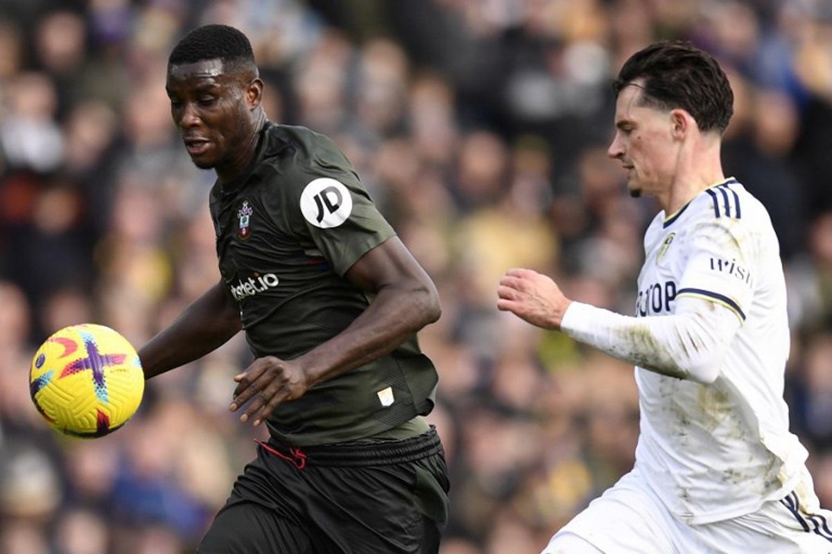 Leeds United's German defender Robin Koch (R) vies with Southampton's Nigerian striker Paul Onuachu during the English Premier League football match between Leeds United and Southampton at Elland Road in Leeds, northern England on February 25, 2023.  Oli SCARFF / AFP
