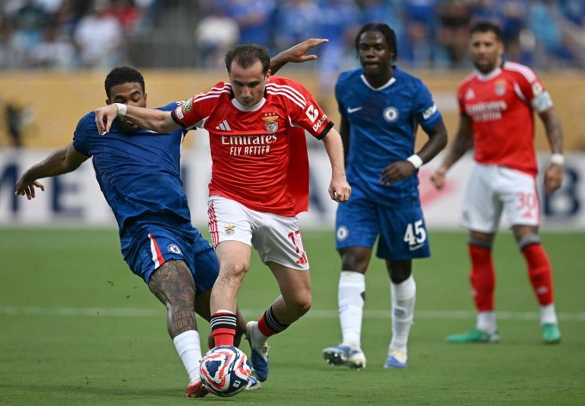 Chelsea's English defender #24 Reece James and Benfica's Turkish midfielder #17 Muhammed Akturkoglu fight for the ball during the FIFA Club World Cup 2025 round of 16 football match between Portugal's Benfica and England's Chelsea at the Bank of America Stadium in Charlotte on June 28, 2025.  Paul ELLIS / AFP