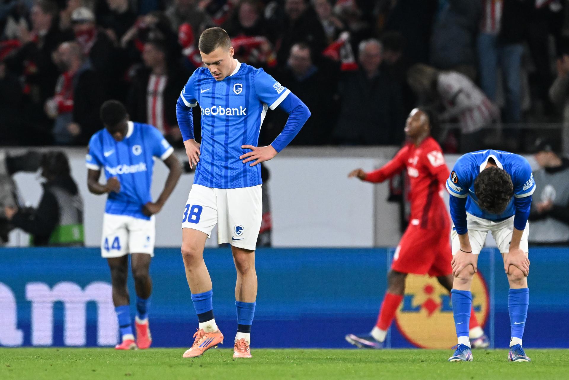 Genk's Josue Kongolo, Genk's Daan Heymans and Genk's Konstantinos Kos Karetsas look dejected during a soccer game between German Sport-Club Freiburg and Belgian KRC Genk in Freiburg im Breisgau, Germany on Thursday 19 March 2026, the return leg of the 1/16 Finals of the UEFA Europa League tournament. Genk won the first leg 1-0. BELGA PHOTO JILL DELSAUX