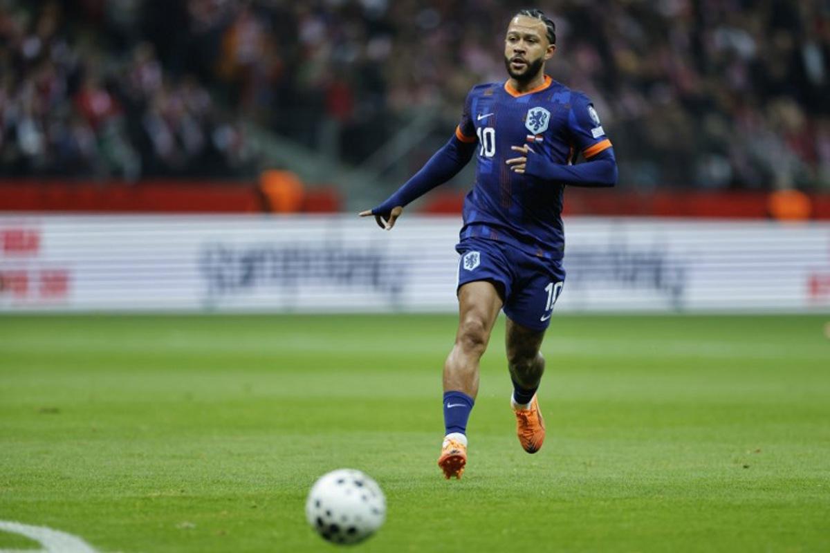 Netherlands' forward #10 Memphis Depay controls the ball during the 1st round - day 9 - Group G World Cup 2026 European Qualifiers football match between Poland and the Netherlands on November 14, 2025 in Warsaw, Poland.  Wojtek RADWANSKI / AFP