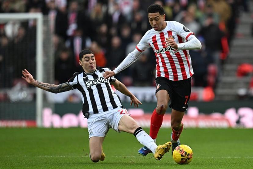 Newcastle United's Paraguayan midfielder #24 Miguel Almiron (L) tackles Sunderland's English midfielder #07 Jobe Bellingham (R) during the English FA Cup third round football match between Sunderland and Newcastle United at The Stadium of Light in Sunderland in north east England on January 6, 2024.  Paul ELLIS / AFP