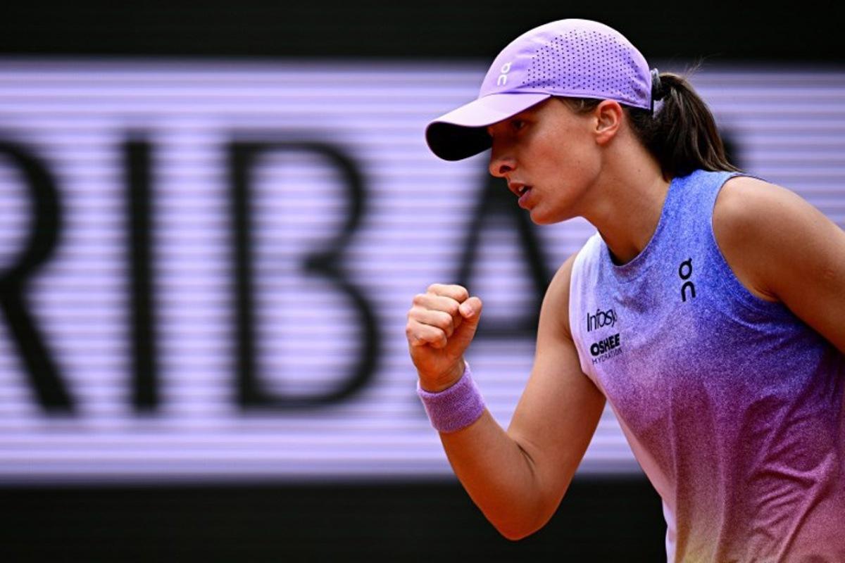 Poland's Iga Swiatek reacts to a point against Kazakhstan's Elena Rybakina during their women's singles match on day 8 of the French Open tennis tournament on Court Philippe-Chatrier at the Roland-Garros Complex in Paris on June 1, 2025.  JULIEN DE ROSA / AFP