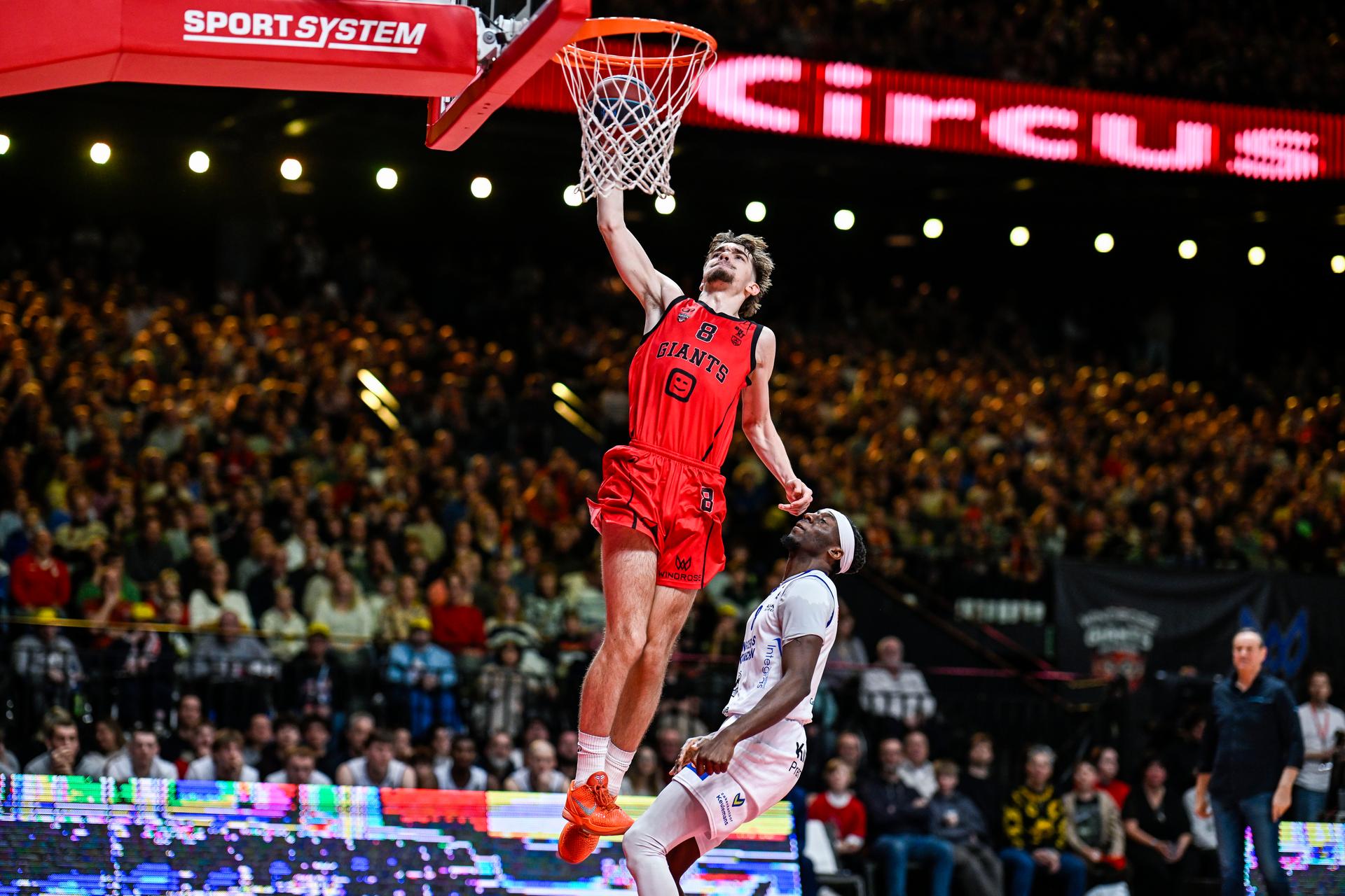 Antwerp's Letto Van Drom and Mechelen's Mojeed Oluwatobi Ewuosho pictured in action during a basketball match between Antwerp Giants and Kangoeroes Mechelen, Friday 30 January 2026 in Antwerp, during the Night of the Giants event on matchday 18/34 in the 'BNXT League' Belgian/ Dutch first division basket championship. BELGA PHOTO TOM GOYVAERTS