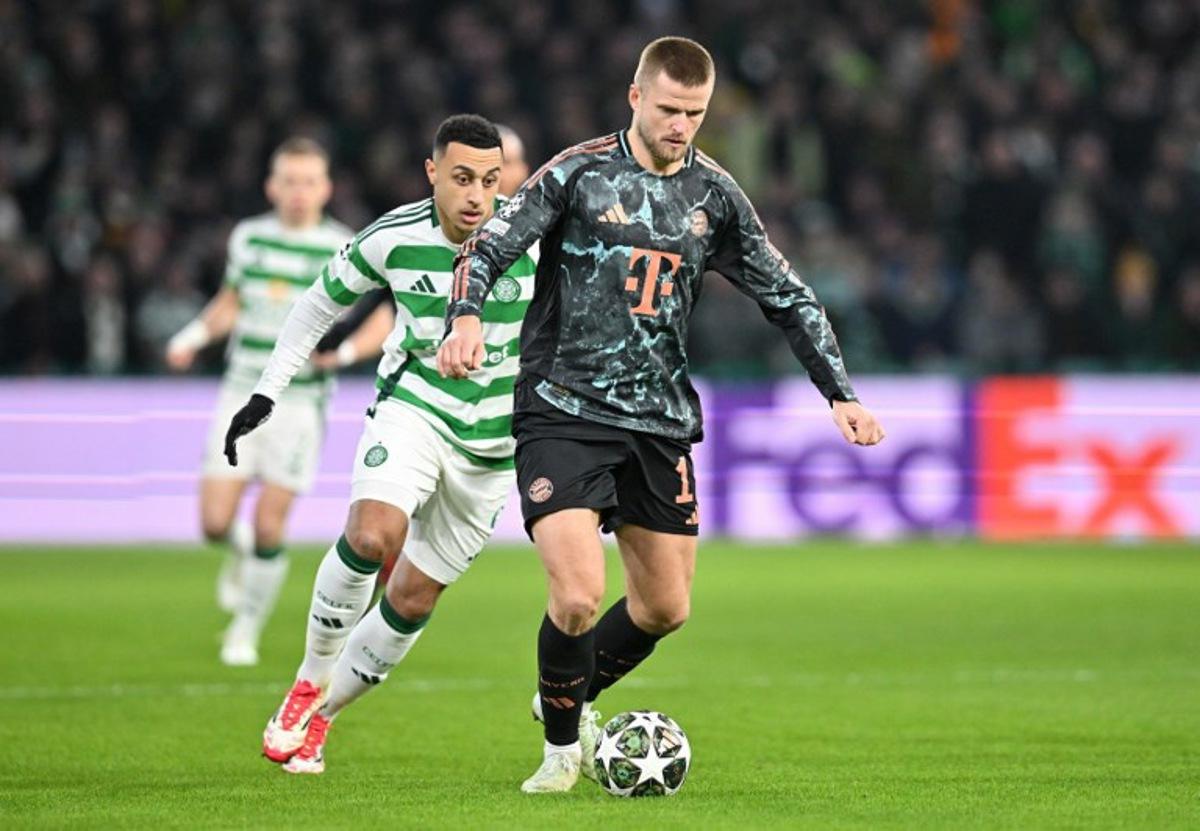 Celtic's Irish striker #09 Adam Idah (L) vies wqith Bayern Munich's English defender #15 Eric Dier during the UEFA Champions League play-off first leg football match between Celtic and Bayern Munich at Celtic Park stadium in Glasgow, Scotland on February 12, 2025.   ANDY BUCHANAN / AFP