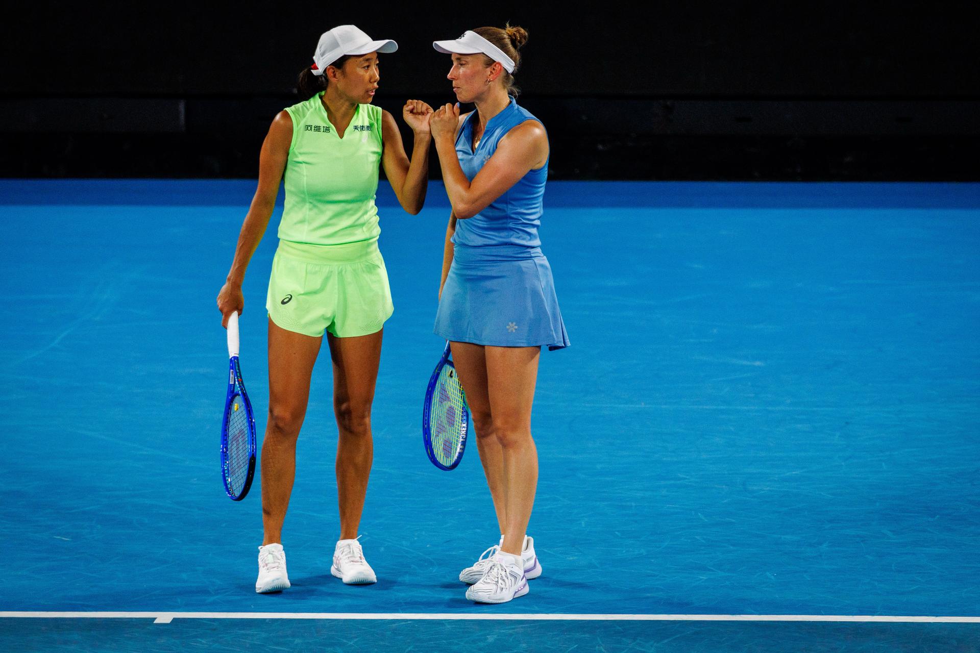 Belgium's Elise Mertens (blue) and Chinese Shuai Zhang (yellow) pictured during a tennis match between US pair Baptiste/Stearns and Belgian/ Chinese pair Mertens/Zhang, in the 1/8 final of the women doubles at the Australian Open, in Melbourne Park, Melbourne on Tuesday 27 January 2026.  BELGA PHOTO PATRICK HAMILTON  --- BENELUX ONLY   ---
