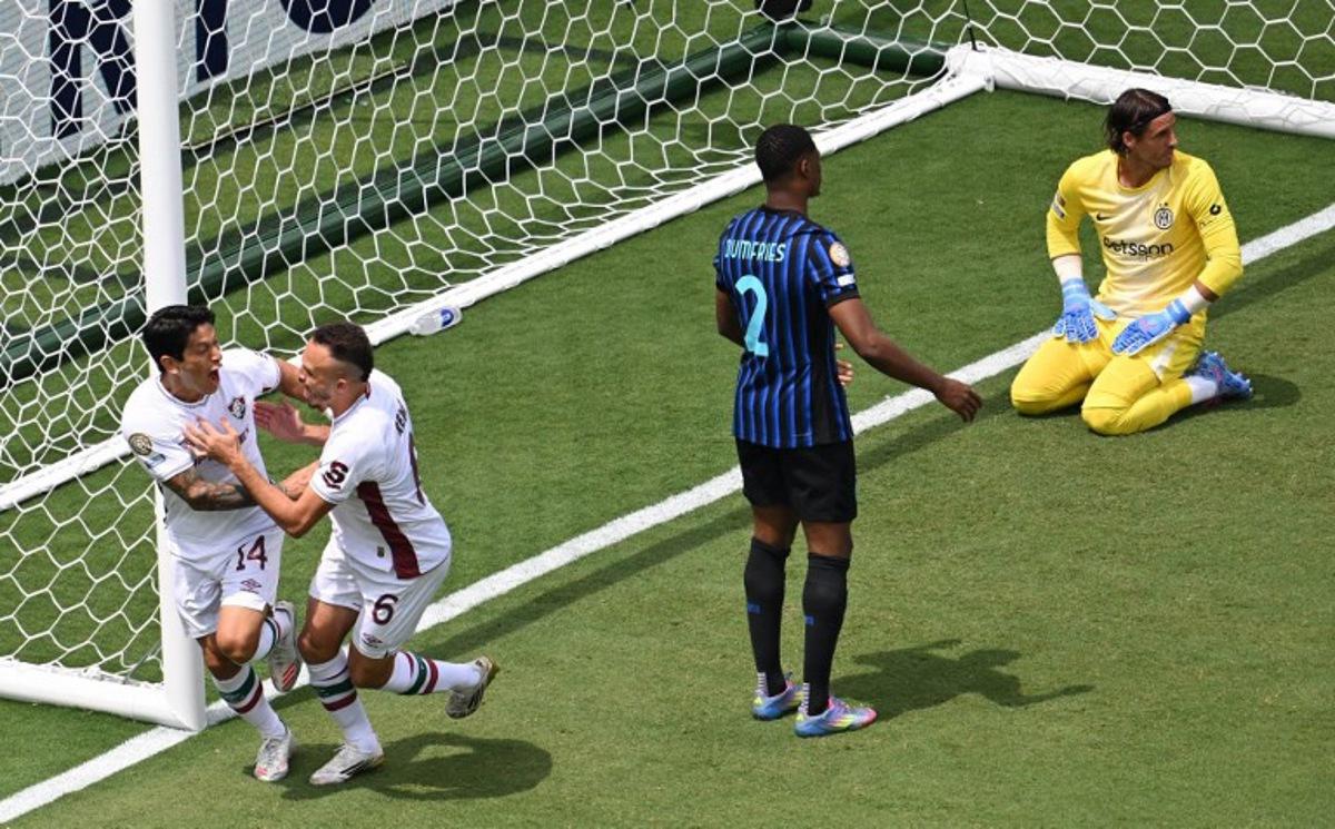 Fluminense's Argentine forward #14 German Cano celebrates after scoring the opening goal with teammate Fluminense's Brazilian defender #06 Rene during the FIFA Club World Cup 2025 round of 16 football match between Italy's Inter Milan and Brazil's Fluminense at the Bank of America Stadium in Charlotte on June 30, 2025.  Federico PARRA / AFP