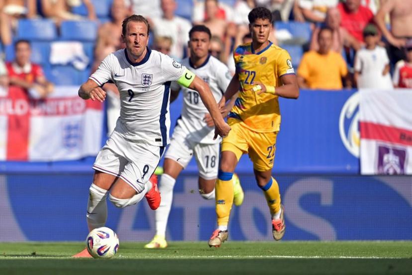 England's forward #09 Harry Kane runs with the ball during the 2026 World Cup qualifiers Europe zone, 1st round group K football match between Andorra and England at RCDE Stadium in Cornella de Llobregat, on June 7, 2025.  MANAURE QUINTERO / AFP