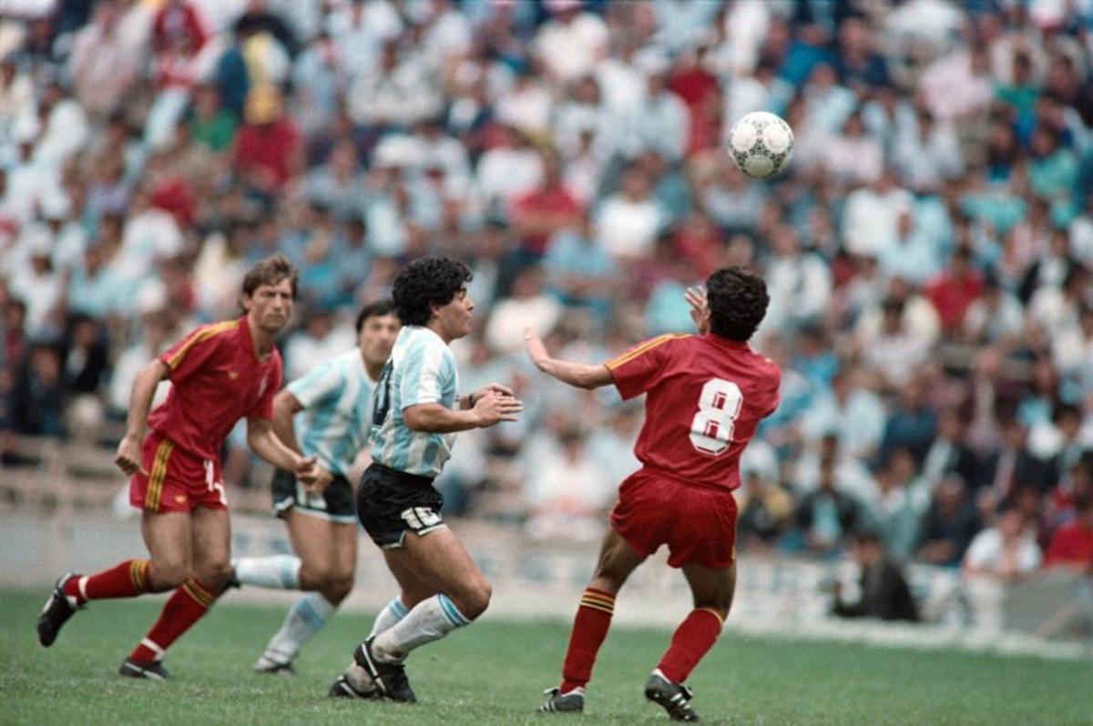 Argentina's Diego Maradona (C) fights for the ball against Belgium's Enzo Scifo (R) during the 1986 World cup football match between Argentina and Belgium on June 25, 1986 in Mexico city.   The 1986 FIFA World Cup was the thirteenth edition of the tournament, which is held every four years. Held in Mexico from 31 May to 29 June, it was won by Argentina, led by the 25-year-old Diego Maradona, who was at the peak of his career.    AFP
