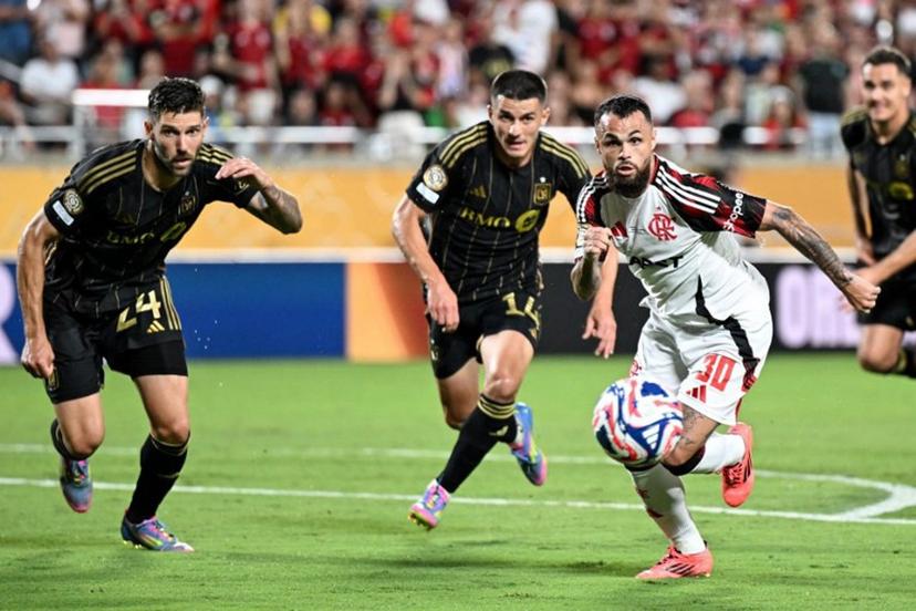 (From L) LAFC's US defender #24 Ryan Hollingshead, LAFC's Spanish defender #14 Sergi Palencia and Flamengo's Brazilian forward #30 Michael fight for the ball during the FIFA Club World Cup 2025 Group D football match between US Los Angeles FC and Brazil's CR Flamengo at the Camping World stadium in Orlando on June 24, 2025.  PATRICIA DE MELO MOREIRA / AFP