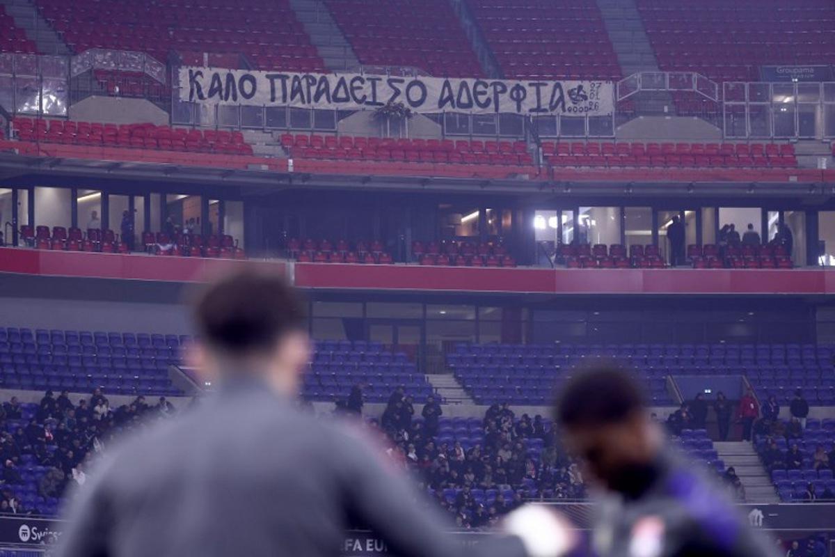 A banner paying tribute to PAOK supporters who died in an accident in Romania is displayed in the stands ahead of the UEFA Europa League - League phase, Matchday 8 - football match between Olympique Lyonnais (OL) and PAOK FC at the Groupama Stadium in Lyon, central-eastern France, on January 29, 2026.  Alex MARTIN / AFP