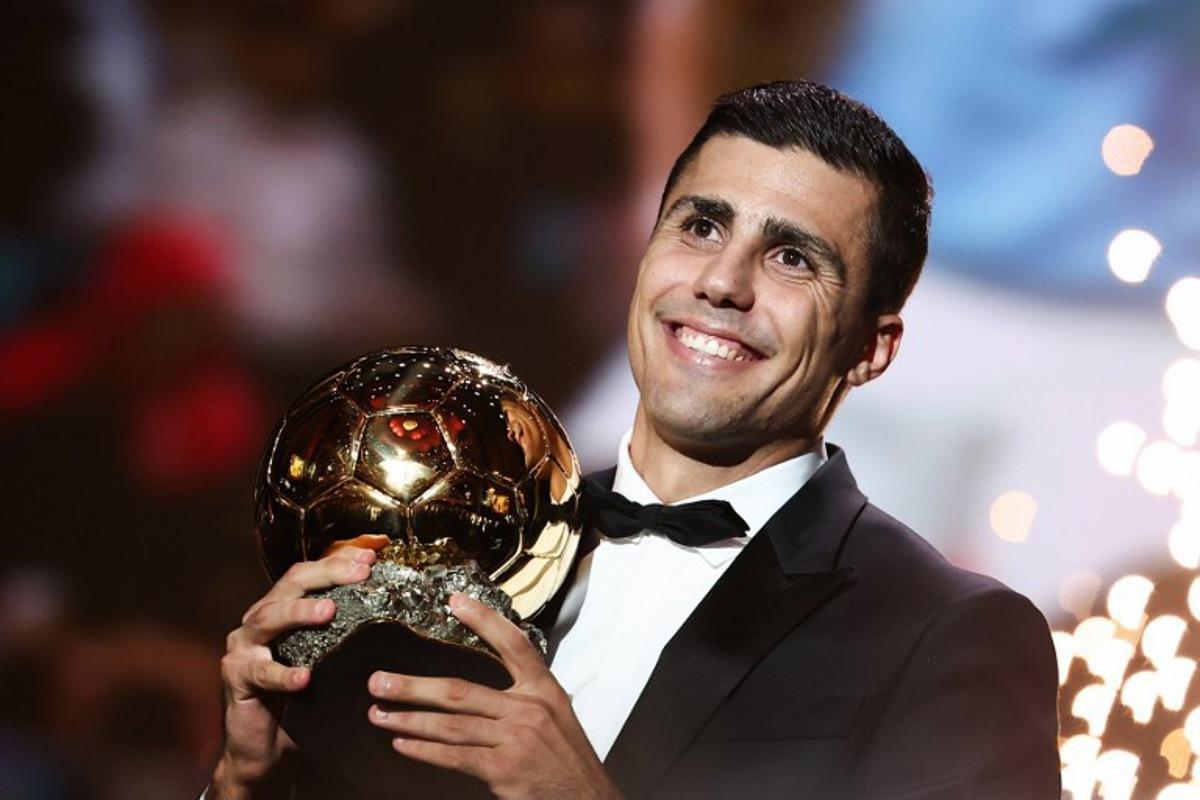 Manchester City's Spanish midfielder Rodri receives the Ballon d'Or award during the 2024 Ballon d'Or France Football award ceremony at the Theatre du Chatelet in Paris on October 28, 2024.  FRANCK FIFE / AFP
