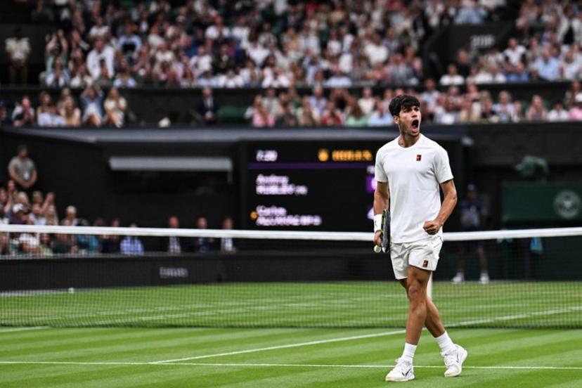 Spain's Carlos Alcaraz celebrates winning a game against Russia's Andrey Rublev during their men's singles fourth round tennis match on the seventh day of the 2025 Wimbledon Championships at The All England Lawn Tennis and Croquet Club in Wimbledon, southwest London, on July 6, 2025.  Kirill KUDRYAVTSEV / AFP