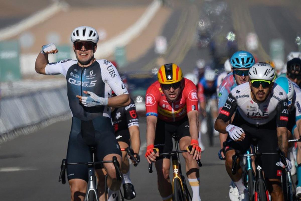 Q36.5 Pro Cycling Team's Italian rider Matteo Moschetti (L) celebrates his victory as he crosses the finish line of the fifth stage of the the Alula Tour cycling race in Alula on February 1, 2025.  Loic VENANCE / AFP