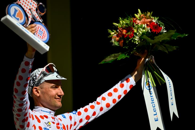 Belgian Tim Wellens of UAE Team Emirates celebrates on the podium in the red polka-dot jersey for best climber after stage six of the 2025 Tour de France cycling, from Bayeux to Vire Normandie (201 km), on Thursday 10 July 2025 in France. The 112th edition of the Tour de France starts on Saturday 5 July in Lille, France, and will finish in Paris, France on the 27th of July. BELGA PHOTO JASPER JACOBS