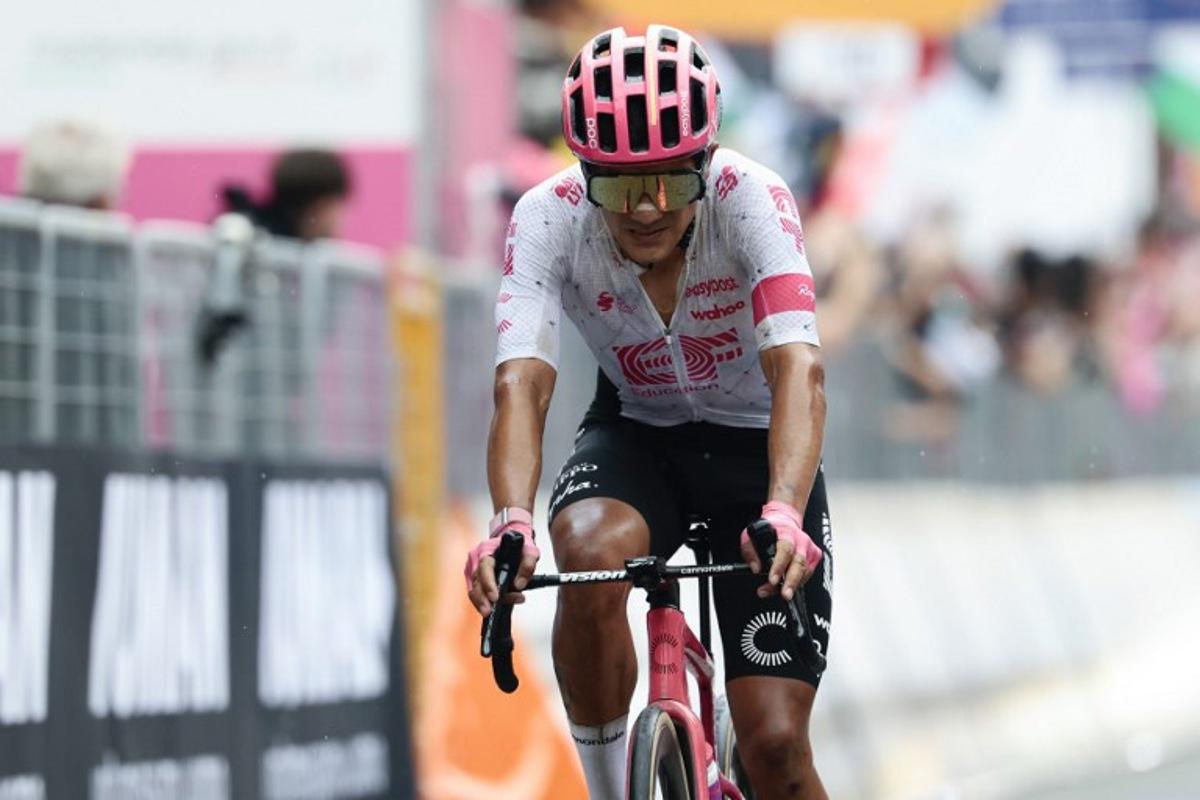 EF Education - EasyPost's Ecuadorian rider Richard Carapaz reacts as he crosses the finish line of the 20th stage of the 108th Giro d'Italia cycling race 205kms from Verres to Sestriere on May 31, 2025.  Luca Bettini / AFP