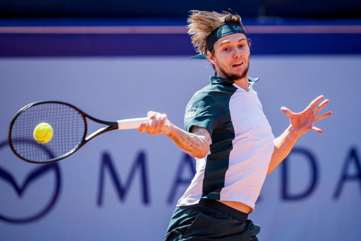Kazakhstan's Alexander Bublik returns the ball to Argentina's Juan Manuel Cerundolo during their men's singles final match at the Swiss Open tennis tournament in Gstaad, on July 20, 2025.  Fabrice COFFRINI / AFP