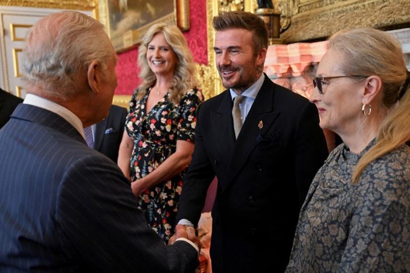 English former football player David Beckham (C) shakes hands with Britain's King Charles III (L) during the King's Foundation Awards ceremony, on the 35th anniversary of The King's Foundation, at St James's Palace, in London, on June 12, 2025.   Chris J RATCLIFFE / POOL / AFP