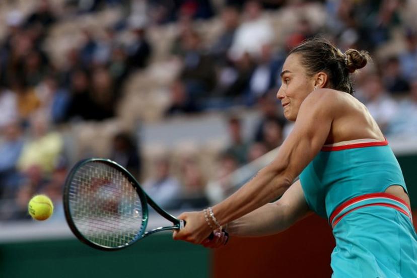 Belarus' Aryna Sabalenka plays a backhand return to Switzerland's Jil Teichmann during their women's singles match on day 4 of the French Open tennis tournament on Court Suzanne-Lenglen at the Roland-Garros Complex in Paris on May 28, 2025.  Alain JOCARD / AFP