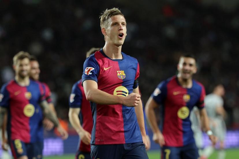 Barcelona's Spanish forward #20 Daniel Olmo celebrates after scoring a penalty kick and his team's second goal during the Spanish league football match between FC Barcelona and CA Osasuna at Estadi Olimpic Lluis Companys in Barcelona on March 27, 2025.  LLUIS GENE / AFP