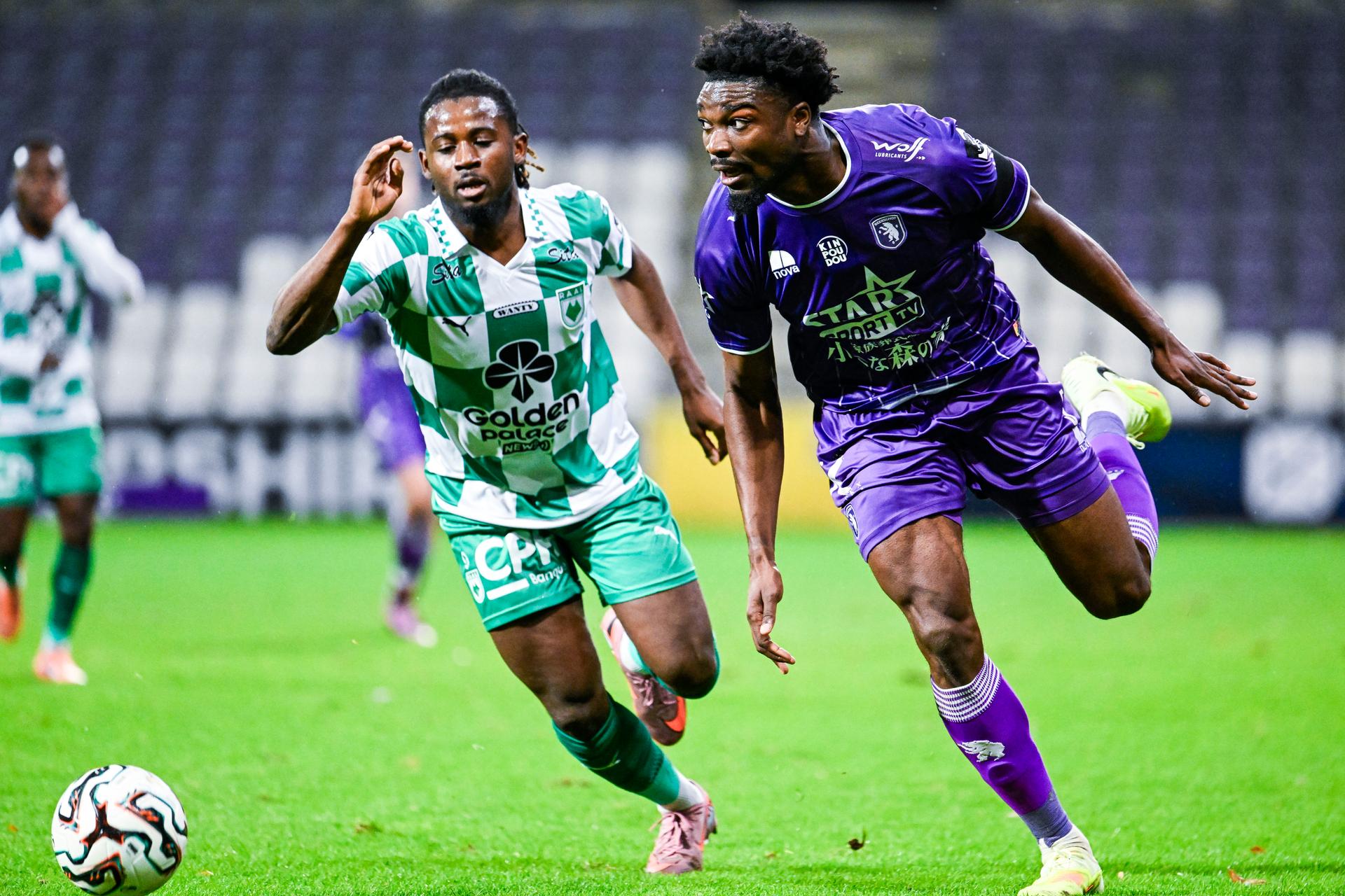 RAAL's Mohamed Guindo and Beerschot's Loic Mbe Soh pictured in action during a soccer game between Beerschot VA (1B) and RAAL La Louviere, a 1/8 final game in the Croky Cup Belgian soccer cup competition, Tuesday 02 December 2025 in Antwerp. BELGA PHOTO TOM GOYVAERTS