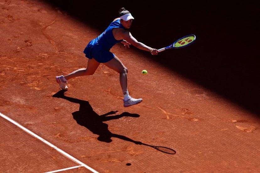 Belgium's Elise Mertens returns the ball to Belarus' Aryna Sabalenka during their 2025 WTA Tour Madrid Open tennis tournament third round singles match at the Caja Magica in Madrid, on April 27, 2025.   Thomas COEX / AFP