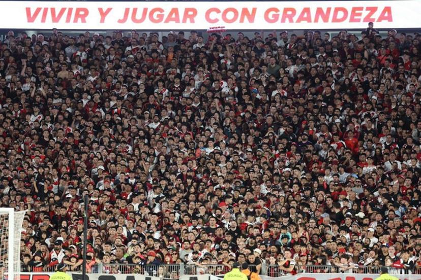 River Plate fans are pictured during the Argentine Professional Football League 2025 Clausura Tournament match between River Plate and Gimnasia at the Mas Monumental Stadium in Buenos Aires on November 2, 2025.  ALEJANDRO PAGNI / AFP
