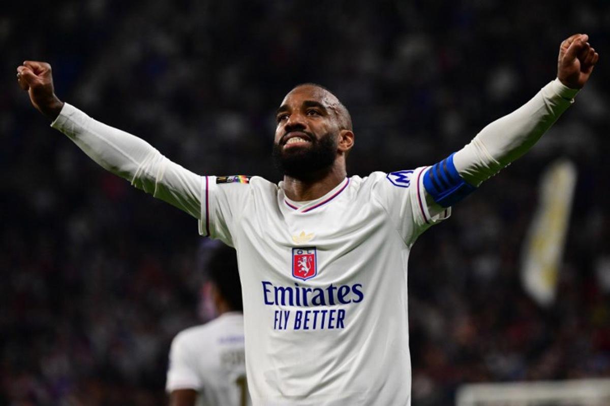 Lyon's French forward #10  Alexandre Lacazette celebrates after scoring a goal during the French L1 football match between Olympique Lyonnais (OL) and  SCO Angers at The Groupama Stadium in Decines-Charpieu, central-eastern France on May 17, 2025.  OLIVIER CHASSIGNOLE / AFP