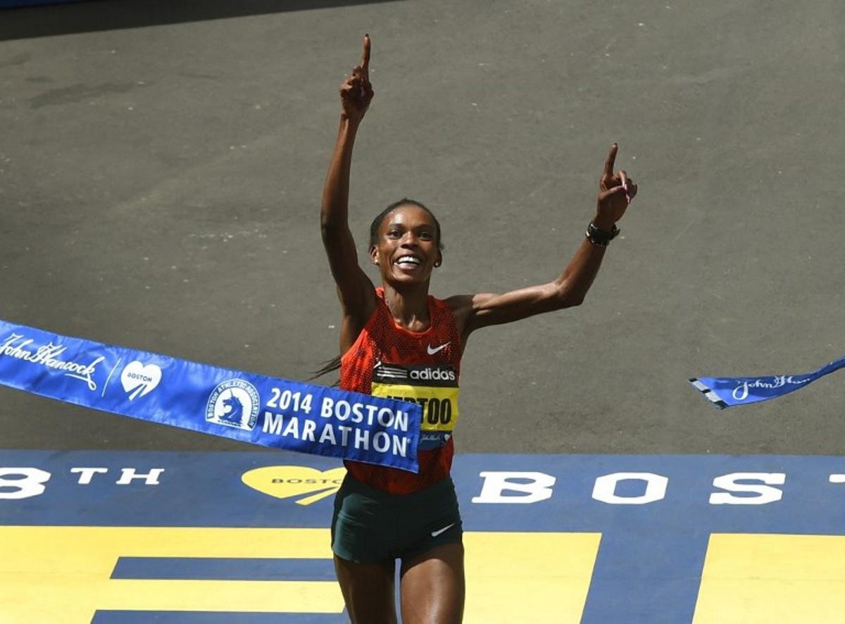 Rita Jeptoo of Kenya reacts as she crosses the finish line to win the Women's Elite division of the 118th Boston Marathon in Boston, Massachusetts April 21, 2014.  AFP PHOTO / Timothy A. CLARY  TIMOTHY A. CLARY / AFP