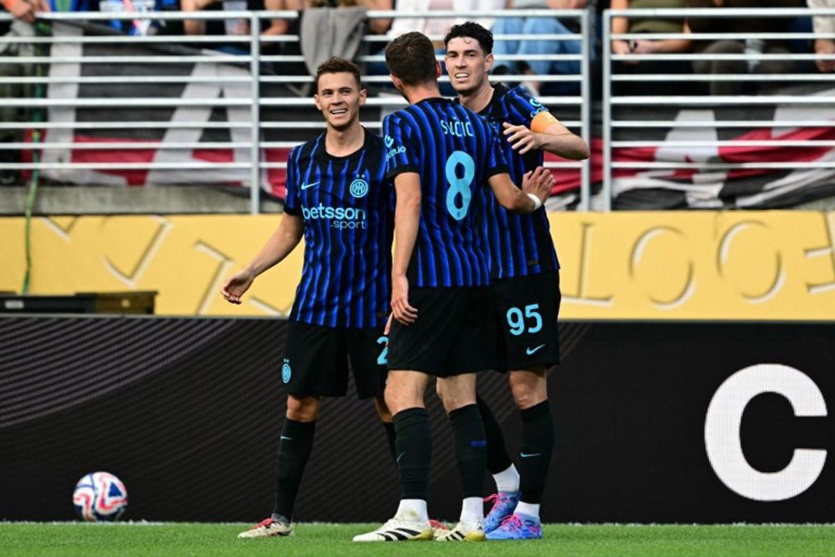Inter Milan's Italian defender #95 Alessandro Bastoni (R) celebrates with teammates Albanian midfielder #21 Kristjan Asllani (L) and Bosnian midfielder #08 Petar Sucic after scoring his team's second goal during the FIFA Club World Cup 2025 Group E football match between Italy's Inter Milan and Argentina's River Plate at the Lumen Field stadium in Seattle on June 23, 2025.  Pablo PORCIUNCULA / AFP