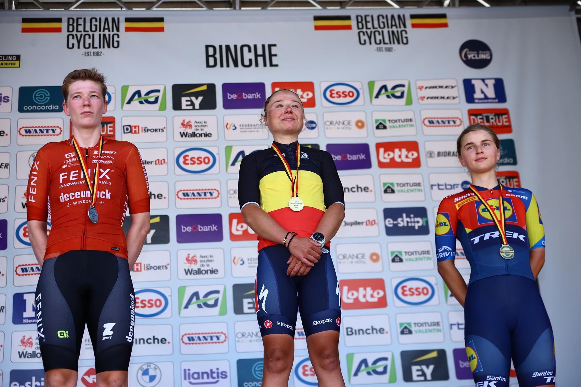 Belgian Fien Van Eynde of Fenix-Deceuninck Development Team, Belgian Justine Ghekiere of AG Insurance-Soudal Team and Belgian Fleur Moors of Lidl-Trek pictured on the podium after the women's elite road race of the Belgian Cycling Championships, 132,8 km from and to the Grand Place square in Binche on Sunday 29 June 2025. BELGA PHOTO DAVID PINTENS
