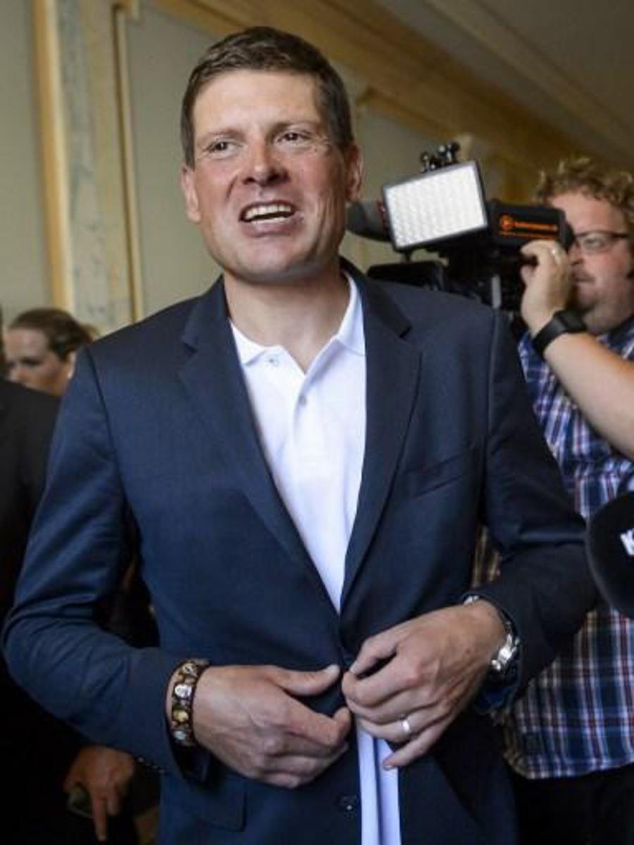 Former German cyclist Jan Ullrich leaves after his appearance before a court in Weinfelden on July 21, 2015 for his involvement in a three-car crash and driving under the influence of alcohol last year.   AFP PHOTO / FABRICE COFFRINI