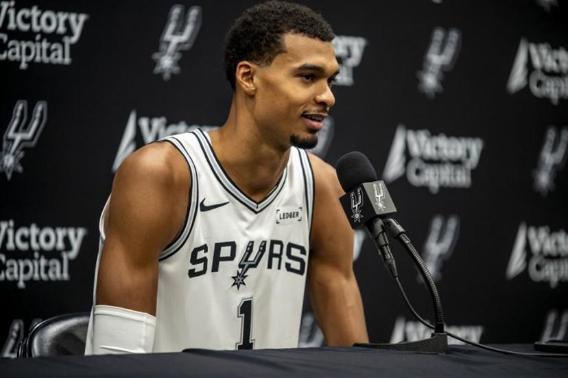 French basketball player Victor Wembanyama speaks to reporters during the San Antonio Spurs media day at the Victory Capital Performance Center in San Antonio, Texas on September 29, 2025. Wembanyama has been cleared by the team's medical staff to play for the upcoming season. SERGIO FLORES / AFP