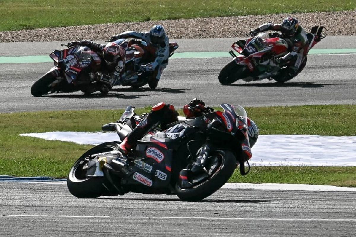 Aprilia Racing's Italian rider Marco Bezzecchi (C) competes during the MotoGP Thailand Grand Prix at the Buriram International Circuit in Buriram on March 1, 2026.  Lillian SUWANRUMPHA / AFP