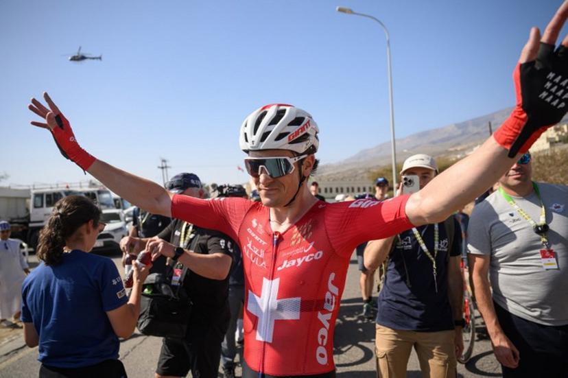 Team Jayco AlUla Swiss rider Mauro Schmid celebrates after winning the 3d stage of the Tour of Oman cycling race from Samail "Al Fayhaa Resthouse" to Misfat Al Abriyeen, on February 9, 2026.  Loic VENANCE / AFP