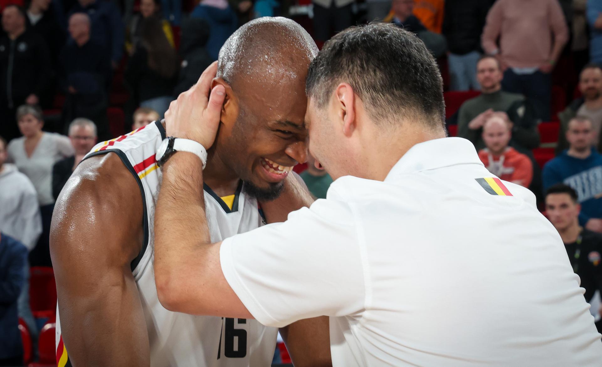 Belgium's Kevin Tumba and Belgium's head coach Dario Gjergja celebrate after winning a basketball match between Belgium's national team Belgian Lions and Slovakia, Thursday 20 February 2025 in Charleroi, game 5/6 in the group stage of the qualifications for the Eurobasket 2025 European championships. BELGA PHOTO VIRGINIE LEFOUR